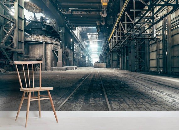 Industrial warehouse mural installed behind a chair